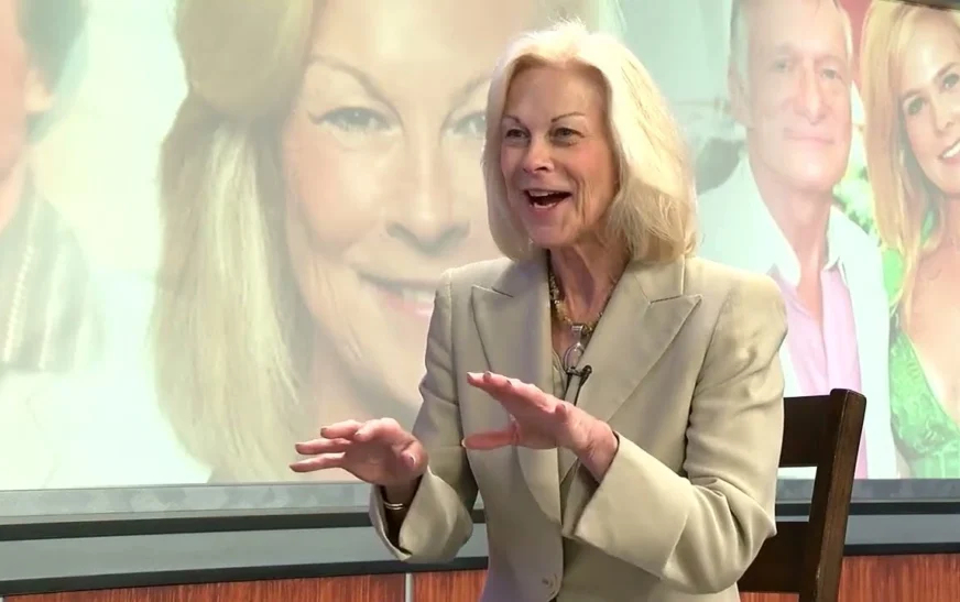 Christie Hefner speaking at a business event, showcasing her leadership as CEO of Playboy Enterprises, with a focus on Christie Hefner’s transformative career.